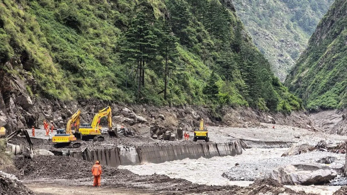Rescue workers repair a damaged road leading to Gyirong Port following a mudslide, in Shigatse, Tibet Autonomous Region, China August 27, 2026. China Daily via REUTERS ATTENTION EDITORS - THIS PICTURE WAS PROVIDED BY A THIRD PARTY. CHINA OUT. NO COMMERCIAL OR EDITORIAL SALES IN CHINA.